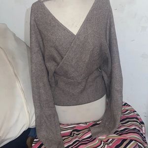 Sweater with tie front taupe viscose polyester and nylon blend.